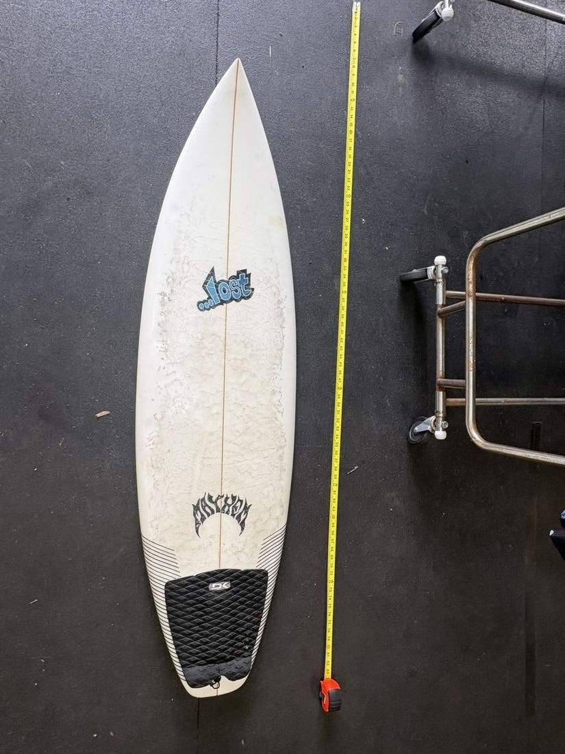 Lost · 5' 9" — Deck nose up, tape right