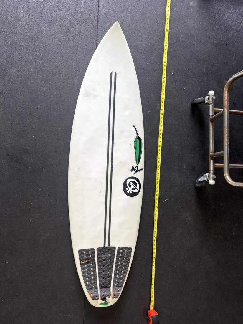 Green Chili · 5'5" — Deck nose up, tape right