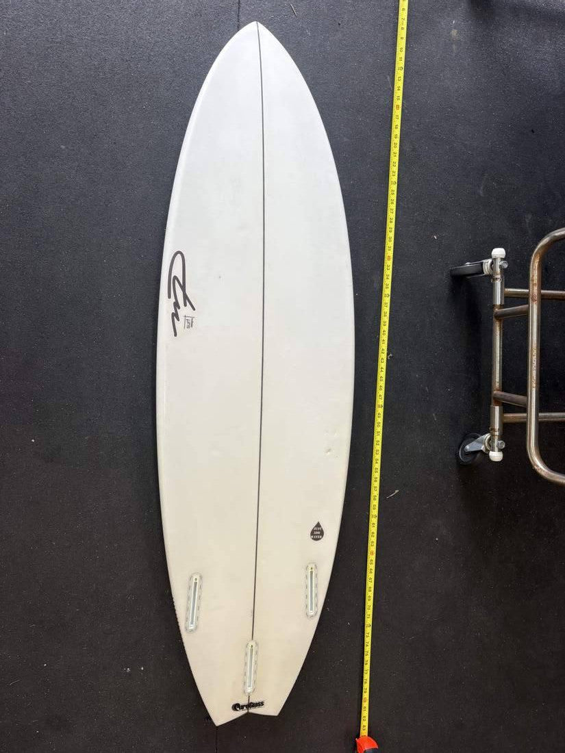 Surfglass · 5' 9" Bottom; nose up; yellow tape right