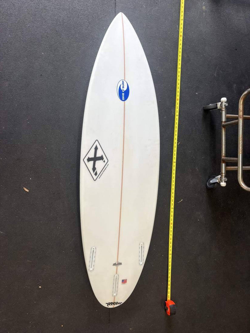 Xanadu · 5' 9" — Bottom, nose up and measuring tape on right