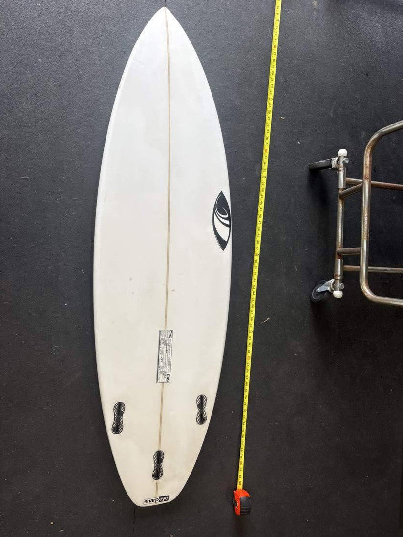 Sharpeye · 5' 10" — Bottom, nose up and measuring tape on right