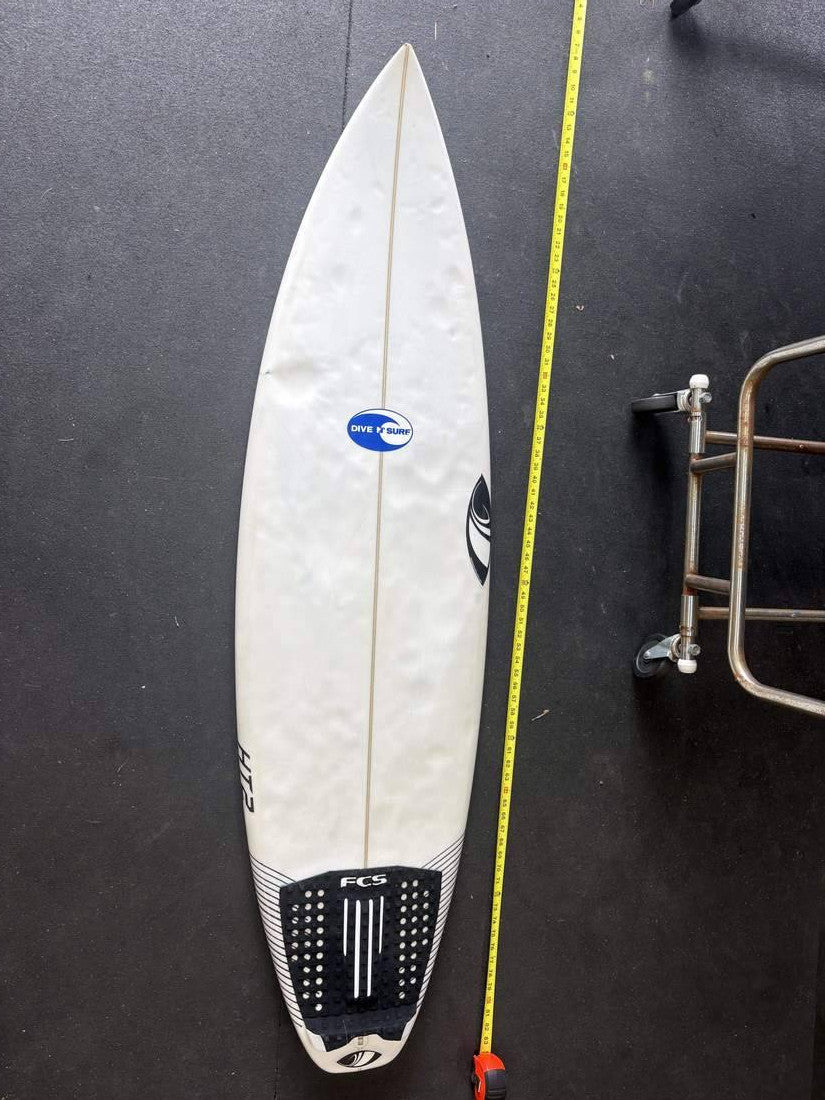 Sharpeye · 5' 10" — Deck, nose up and measuring tape on right