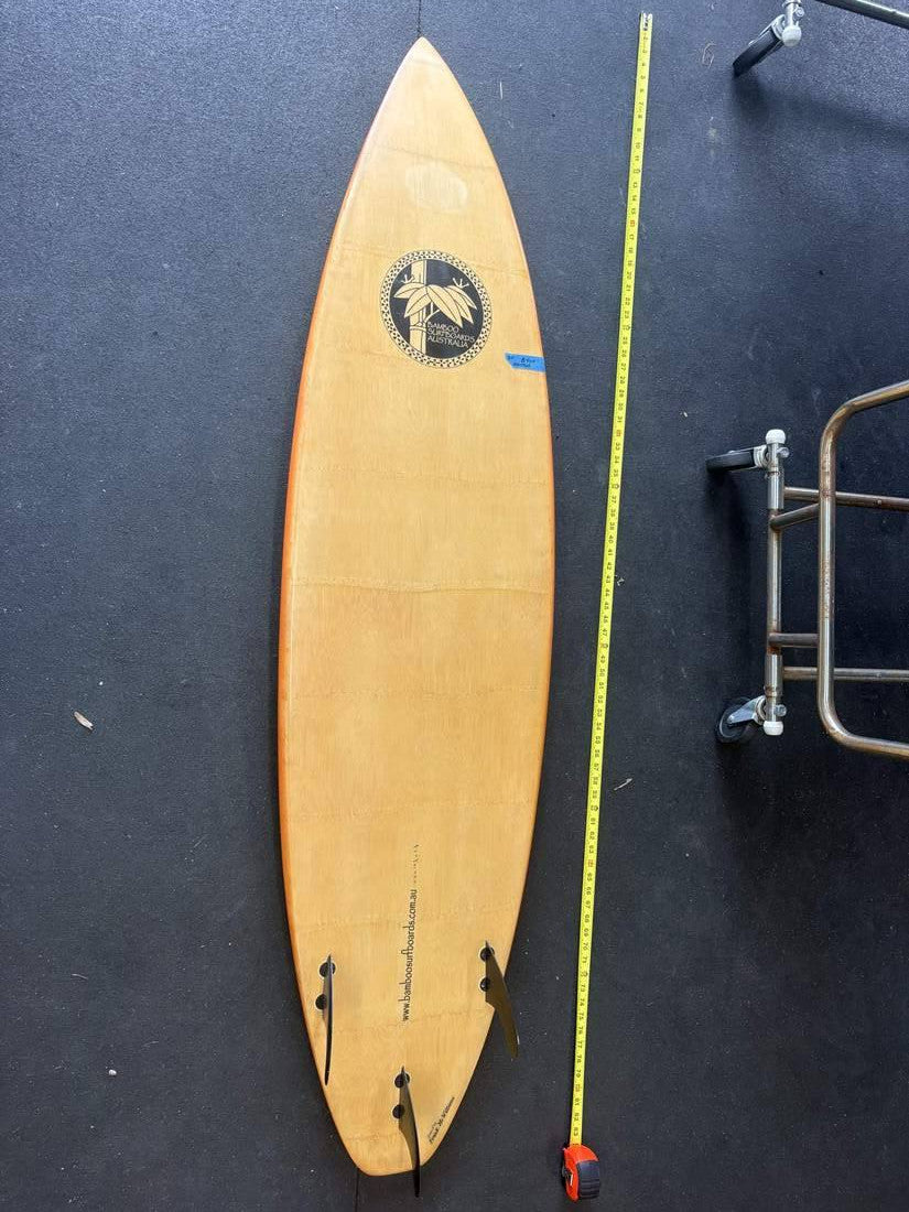 Bamboo Surfboards Australia · 6' 6" — Bottom, nose up, tape on right