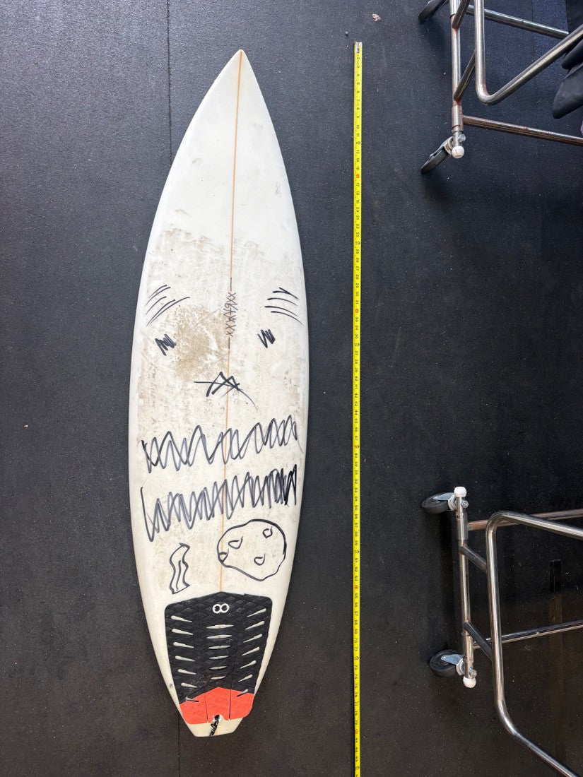 Scribbles · 5' 10" — Deck, nose up, tape on right