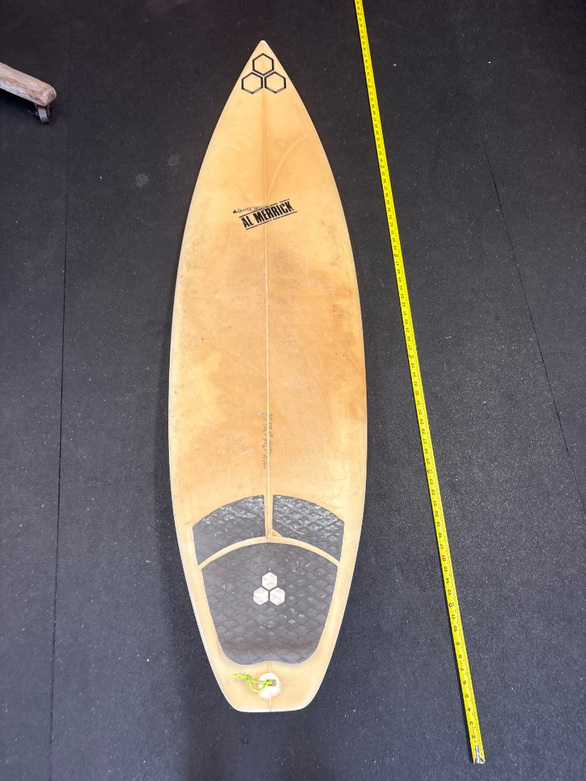 Al Merrick · 6'2" deck view, nose up, yellow measuring tape on right