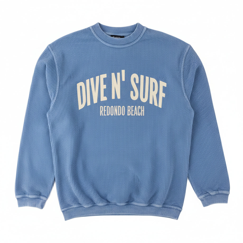 Light Blue corduroy sweatshirt with 'DIVE N' SURF REDONDO BEACH' text on a white background