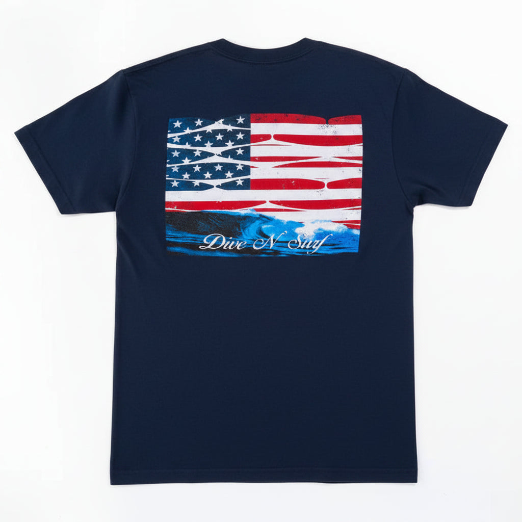 White t-shirt with American flag design on the back, featuring the text 'Dive N Surf'.